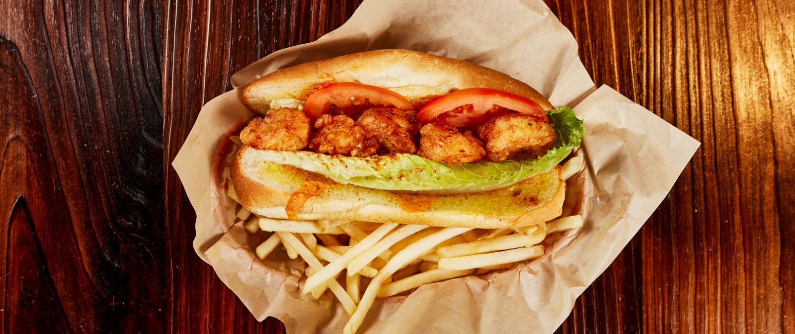 Fried shrimp sandwich with fries